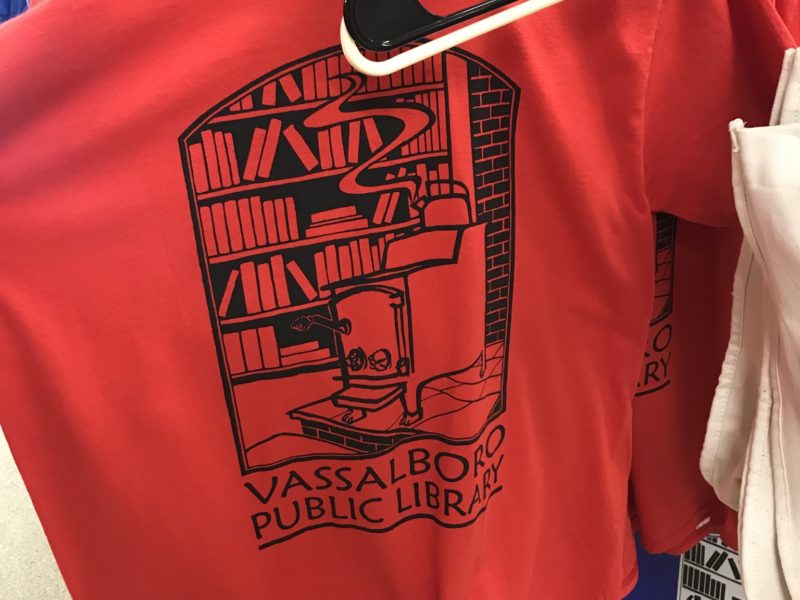 A red t-shirt with the VPL logo on it